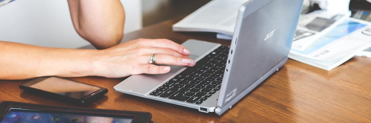 Hands typing on a keyboard
