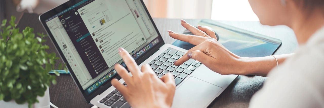 Studying an online course on a laptop