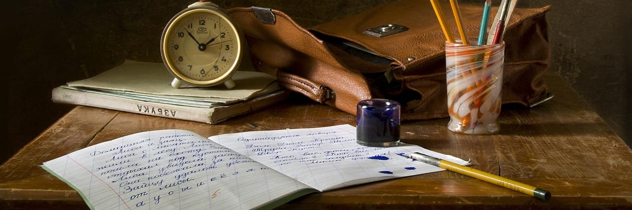 A calculator and pencil on a desk