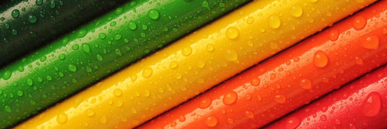 Colour pencils fanned out in a rainbow