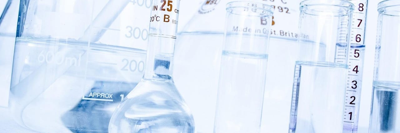 Chemical bottles handled with protective gloves